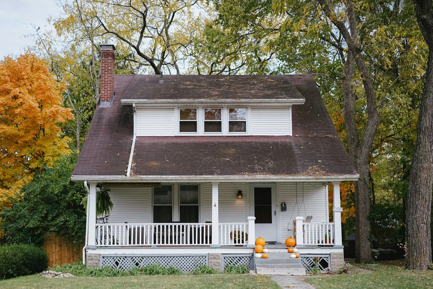 A photographer with a professional camera capturing a home interior